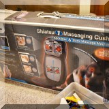 E26. Shiatsu massaging cushion.